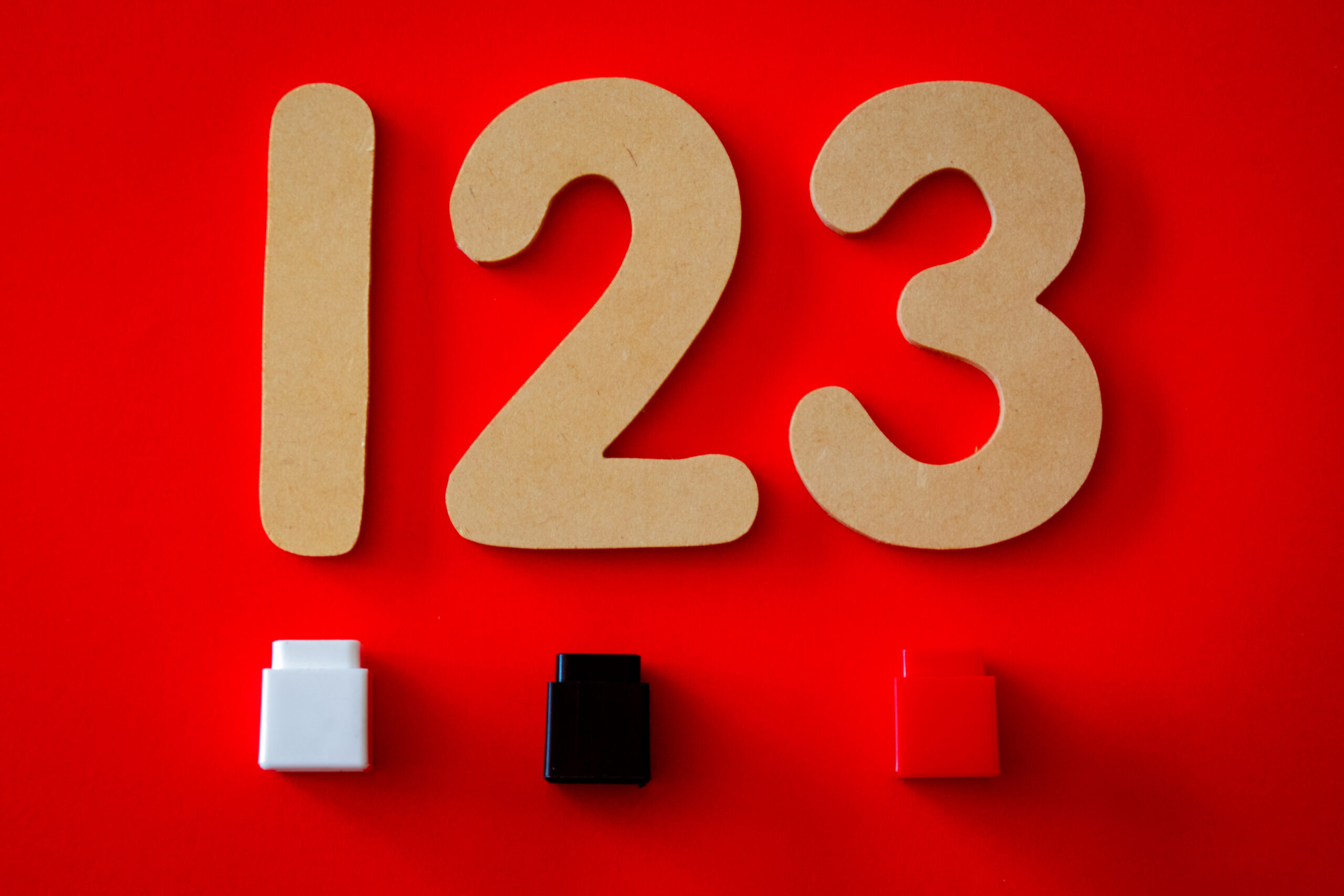 123 cutout decor on red surface